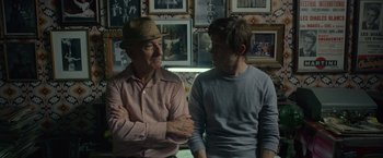 Movie still from “The Walk” (2015), directed by Robert Zemeckis – A man and a young boy are talking to each other; Close Up shot, Over the shoulder angle