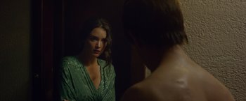 Movie still from “The Walk” (2015), directed by Robert Zemeckis – A woman looking into a mirror while standing next to a man; Close Up shot, Over the shoulder angle
