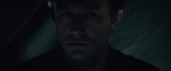 Movie still from “The Walk” (2015), directed by Robert Zemeckis – A person's face in the dark; Close Up shot, High angle