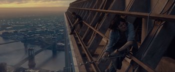 Movie still from “The Walk” (2015), directed by Robert Zemeckis – Two men are working on the side of a skyscraper; Wide shot, High angle