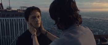 Movie still from “The Walk” (2015), directed by Robert Zemeckis – A man is helping a woman with her hair; Close Up shot, Over the shoulder angle