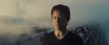 Movie still from “The Walk” (2015), directed by Robert Zemeckis – A person wearing a black t - shirt; Close Up shot, Low angle