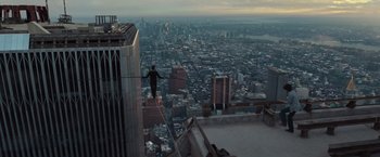 Movie still from “The Walk” (2015), directed by Robert Zemeckis – A man walking across a rope on a tall building; Extreme Wide shot, High angle