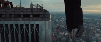 Movie still from “The Walk” (2015), directed by Robert Zemeckis – Two men standing on the top of a building; Wide shot, Low angle