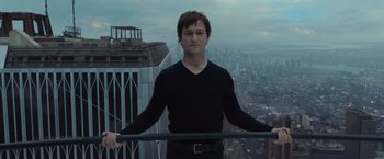 Movie still from “The Walk” (2015), directed by Robert Zemeckis – A man standing on top of a tall building; Medium shot, Low angle
