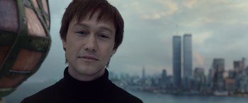 Movie still from “The Walk” (2015), directed by Robert Zemeckis – A person wearing a black shirt; Close Up shot, High angle