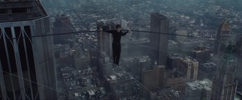 Movie still from “The Walk” (2015), directed by Robert Zemeckis – A man standing on a wire above a city; Extreme Wide shot, High angle