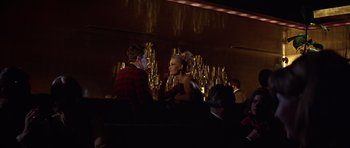 Movie still from “Funeral in Berlin” (1966), directed by Guy Hamilton – A man and a woman sitting at a table; Medium shot, Over the shoulder angle