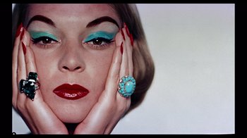 Movie still from “Funny Face” (1957), directed by Stanley Donen – A person wearing a ring; Close Up shot, Overhead angle