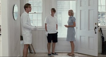 Movie still from “Funny Games” (2007), directed by Michael Haneke – A group of people standing in front of a door; Medium shot, Low angle