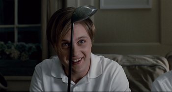 Movie still from “Funny Games” (2007), directed by Michael Haneke – A woman with a golf club in her hand; Close Up shot, High angle