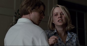 Movie still from “Funny Games” (2007), directed by Michael Haneke – A man and a woman looking at one another; Medium shot, Over the shoulder angle