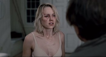 Movie still from “Funny Games” (2007), directed by Michael Haneke – A woman crying in front of another woman; Close Up shot, Over the shoulder angle