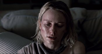 Movie still from “Funny Games” (2007), directed by Michael Haneke – A person sitting on a couch; Close Up shot, High angle