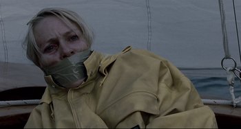 Movie still from “Funny Games” (2007), directed by Michael Haneke – A person with a duct tape over their mouth; Close Up shot, Low angle