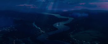 A view of a body of water at night time