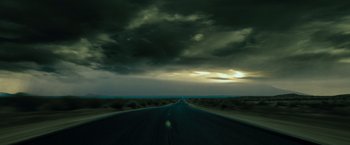 Movie still from “G-Force” (2009), directed by Hoyt Yeatman – A road that has a cloudy sky in the background; Extreme Wide shot, High angle