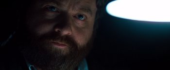 Movie still from “G-Force” (2009), directed by Hoyt Yeatman – A person with a beard and blue eyes; Extreme Close Up shot, Over the shoulder angle