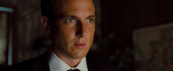 Movie still from “G-Force” (2009), directed by Hoyt Yeatman – A person wearing a suit and tie; Close Up shot, Low angle