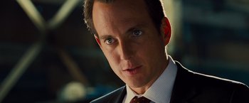 Movie still from “G-Force” (2009), directed by Hoyt Yeatman – A person wearing a suit and tie; Close Up shot, Over the shoulder angle