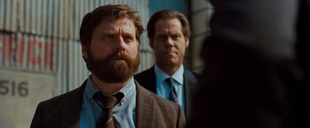 Movie still from “G-Force” (2009), directed by Hoyt Yeatman – Two men in suits and ties standing next to each other; Close Up shot, Over the shoulder angle
