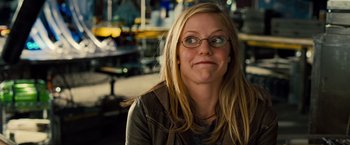 Movie still from “G-Force” (2009), directed by Hoyt Yeatman – A woman wearing glasses and a brown jacket; Close Up shot, Over the shoulder angle
