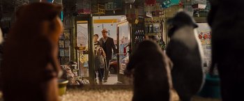 Movie still from “G-Force” (2009), directed by Hoyt Yeatman – A group of people standing in front of a bus; Wide shot, Over the shoulder angle