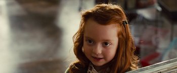 Movie still from “G-Force” (2009), directed by Hoyt Yeatman – A young girl with long red hair; Close Up shot, Over the shoulder angle