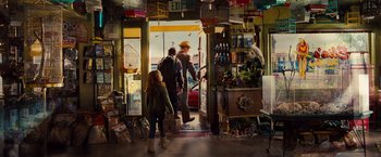 Movie still from “G-Force” (2009), directed by Hoyt Yeatman – A man and a girl are walking into a store; Wide shot, Over the shoulder angle