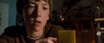 Movie still from “G-Force” (2009), directed by Hoyt Yeatman – A young boy is looking at the camera; Close Up shot, High angle