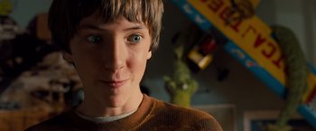Movie still from “G-Force” (2009), directed by Hoyt Yeatman – A young person with blue eyes; Close Up shot, Over the shoulder angle