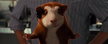Movie still from “G-Force” (2009), directed by Hoyt Yeatman – A brown and white guinea pig with headphones on its head; Close Up shot, High angle