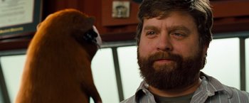 Movie still from “G-Force” (2009), directed by Hoyt Yeatman – A man with a beard is looking at the camera; Close Up shot, Over the shoulder angle