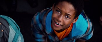 Movie still from “G-Force” (2009), directed by Hoyt Yeatman – A young boy smiling for the camera; Close Up shot, High angle