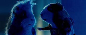 Movie still from “G-Force” (2009), directed by Hoyt Yeatman – A couple of animals that are in the dark; Close Up shot, Over the shoulder angle