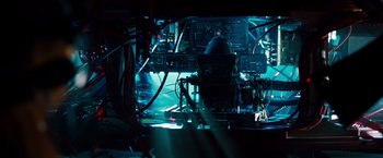 Movie still from “G-Force” (2009), directed by Hoyt Yeatman – A television set in the middle of a dark room; Wide shot, High angle