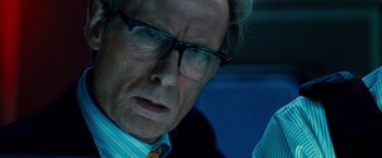 Movie still from “G-Force” (2009), directed by Hoyt Yeatman – An older man wearing glasses looking at the camera; Close Up shot, Over the shoulder angle