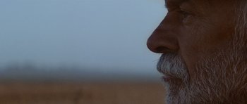 Movie still from “Gallipoli” (1981), directed by Peter Weir – A man's face with a beard; Extreme Close Up shot, Low angle