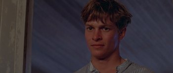 Movie still from “Gallipoli” (1981), directed by Peter Weir – A young man is looking into the camera; Close Up shot, Low angle