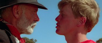 Movie still from “Gallipoli” (1981), directed by Peter Weir – A man and a woman face to face in the sun; Close Up shot, Low angle