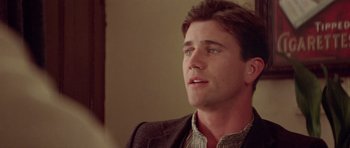 Movie still from “Gallipoli” (1981), directed by Peter Weir – A person wearing a jacket; Close Up shot, Over the shoulder angle