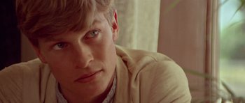 Movie still from “Gallipoli” (1981), directed by Peter Weir – A person wearing a jacket; Close Up shot, Over the shoulder angle