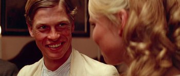 Movie still from “Gallipoli” (1981), directed by Peter Weir – A man and a woman are smiling at each other; Close Up shot, Over the shoulder angle