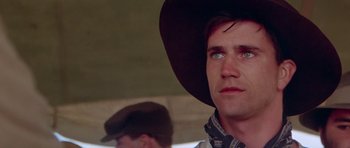 Movie still from “Gallipoli” (1981), directed by Peter Weir – A person wearing a cowboy hat; Close Up shot, Low angle