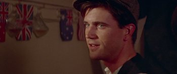 Movie still from “Gallipoli” (1981), directed by Peter Weir – A person wearing a hat; Close Up shot, Over the shoulder angle