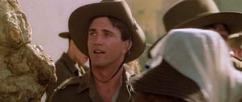 Movie still from “Gallipoli” (1981), directed by Peter Weir – A person wearing a hat; Close Up shot, Over the shoulder angle