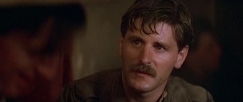 Movie still from “Gallipoli” (1981), directed by Peter Weir – A person with a mustache; Close Up shot, Over the shoulder angle