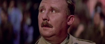 Movie still from “Gallipoli” (1981), directed by Peter Weir – A person with a mustache; Close Up shot, Low angle