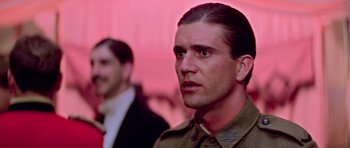 Movie still from “Gallipoli” (1981), directed by Peter Weir – A person wearing a military uniform; Close Up shot, Low angle