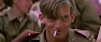 Movie still from “Gallipoli” (1981), directed by Peter Weir – A man with a cigarette in his mouth; Close Up shot, Low angle